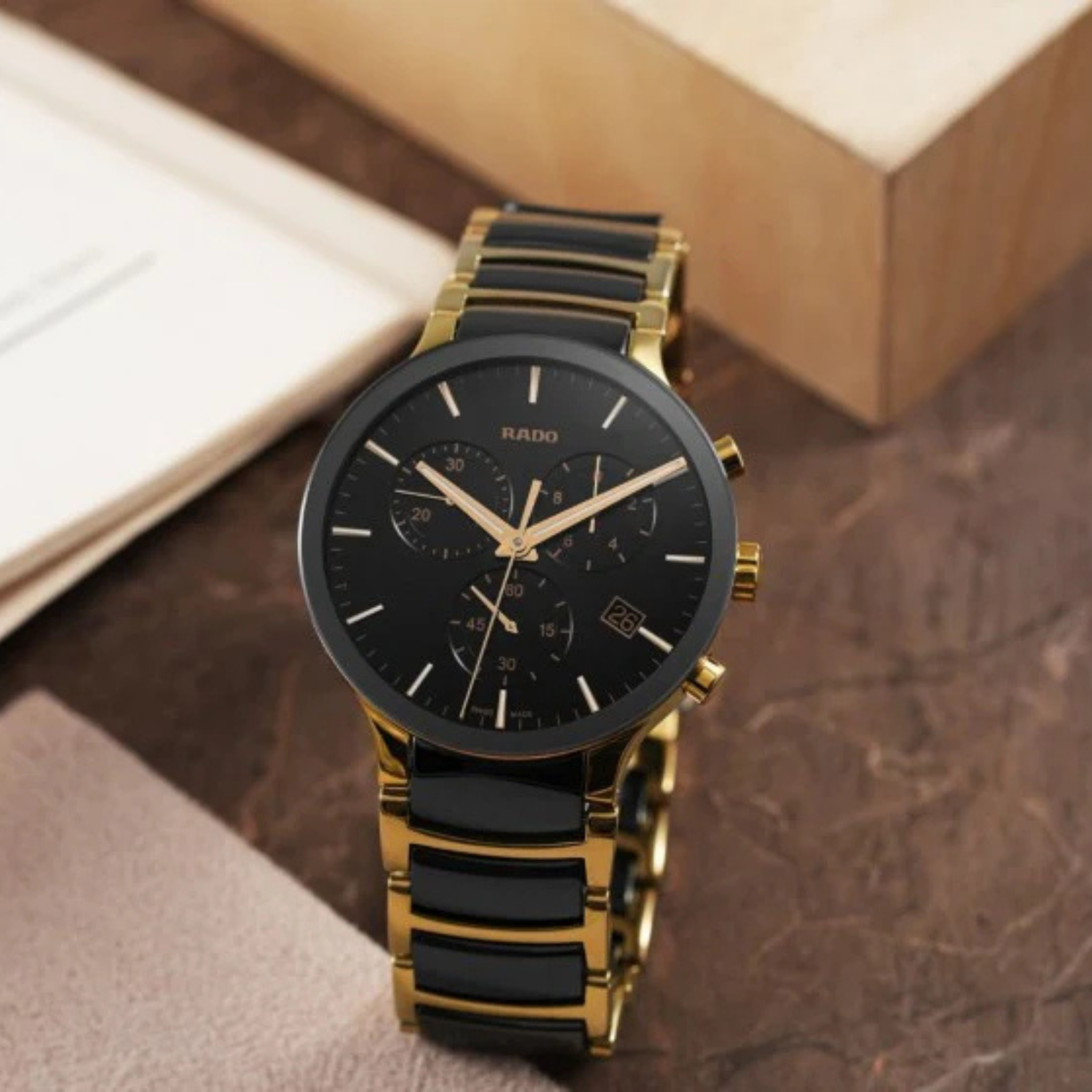 ANALOG BLACK AND GOLD WATCH